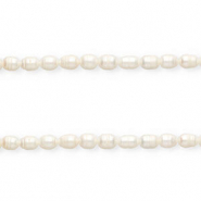 Imperfecte zoetwaterparels rice 9x7-8mm Naturel white