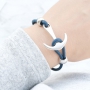 Armbanden en ringen met ankers in blauwe tinten