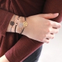 Armbandjes en een sleutelhanger met schitterende bohemian hangers